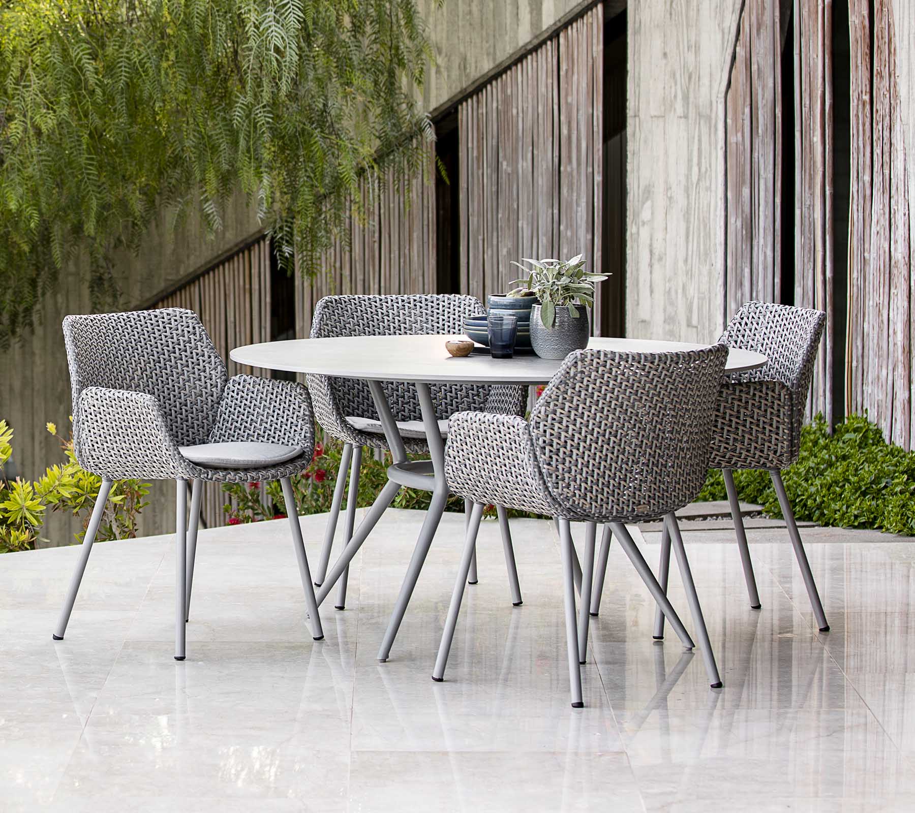 Cane-line Elegant Round Joy Dining Table with Aluminum Base